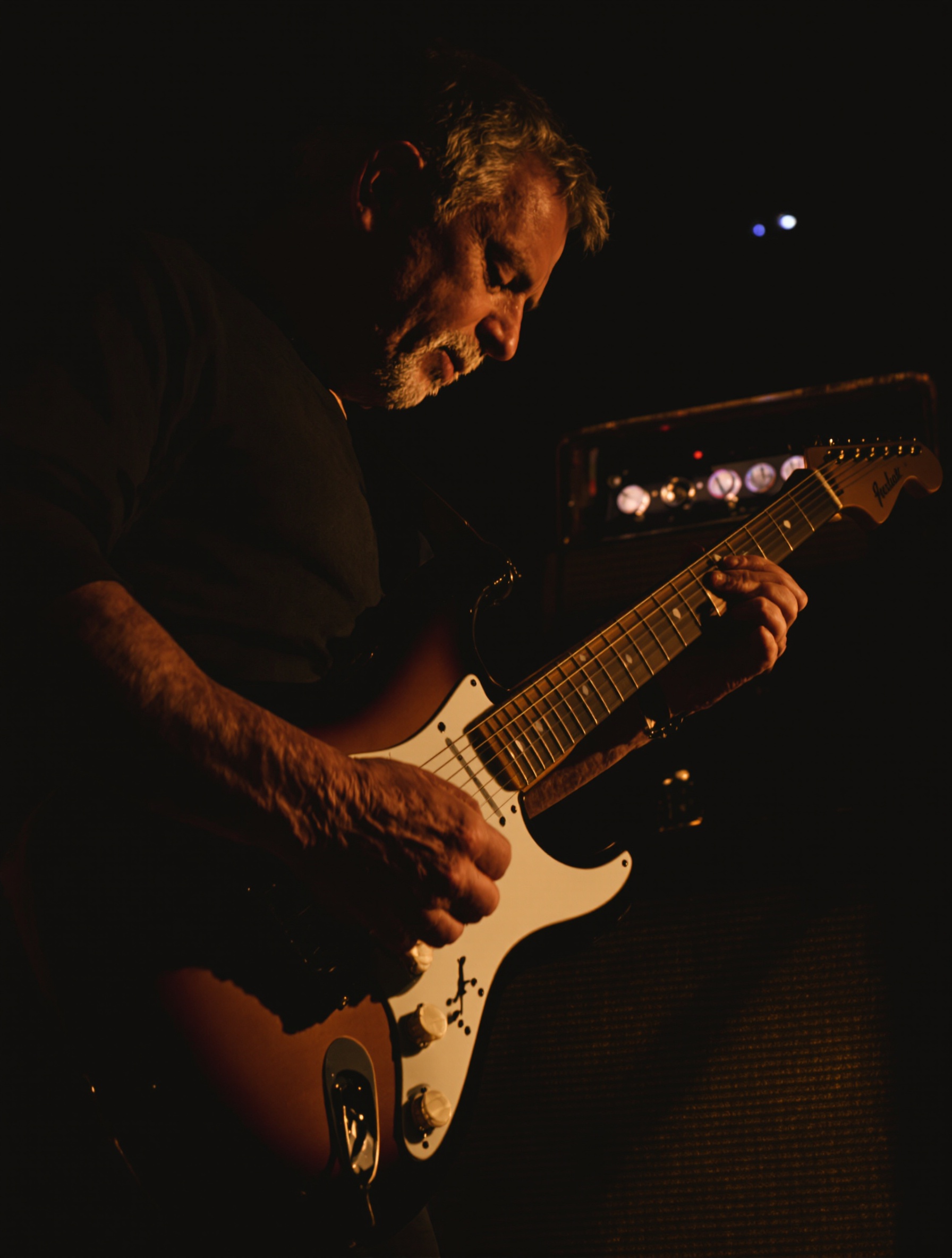 Guitariste intimiste sur un ampli Fender Deluxe Reverb